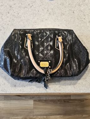 GUESS Black Satchel with Tan Handles and Gold Plaque
